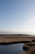 Wattlandschaft unter blauem Himmel Wattlandschaft unter blauem Himmel