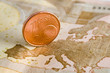 One euro cent on a banknote