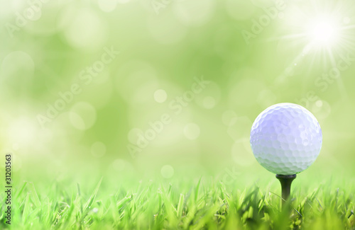 Illustration: Golf ball on tee over a green Golf ball on tee over a green