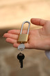 Hand holds lock.