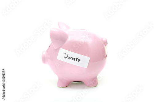 Photo: piggy bank with "donate" label, on white piggy bank with "donate" label, on white