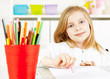 Photo: girl painting picture on table girl painting picture on table