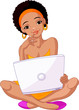 Young African woman sitting on cushion with laptop