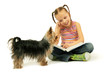 Cute little girl reading a book