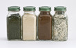 Set of Four Spices in Glass Jars with White Background