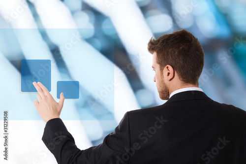 Photo: Businessman using touchscreen Businessman using touchscreen