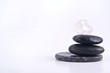 Stack of Balanced Zen Rocks with a White Background