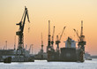 Ship in dry-dock and cranes at sunset, Hamburg, Germany