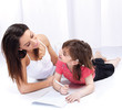 Woman and child drawing on notepad Woman and child drawing on notepad
