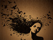Woman with a birds flying from her hair.