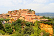 Red ochre cliffs and village of Roussillon, Provence, France