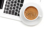 Cappuccino cup on laptop. Above view Cappuccino cup on laptop. Above view