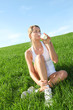 Photo: Beautiful blond woman drinking milk in countryside Beautiful blond woman drinking milk in countryside
