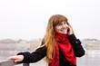 Young girl in the red scarf calling on phone