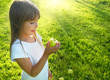 Little girl with apple, sunbeam in background