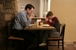 Father And Son Praying Before Meal
