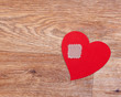 Broken heart on wooden floor with copy space