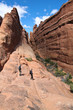 Hikers in a canyon - Arches NP
