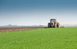 Tractor plowing the fields