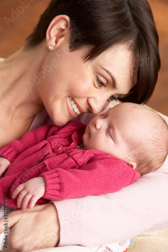 Photo: Portrait Of Mother With Newborn Baby At Home Portrait Of Mother With Newborn Baby At Home