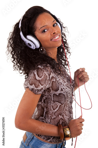 Foto: Young woman listening to music Young woman listening to music
