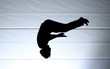 silhouette of jumping man doing somersault silhouette of jumping man doing somersault