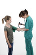doctor measuring blood pressure with medical instrument