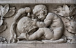 Child sculptor on a frieze