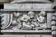 Stone Child sculptor on a frieze