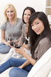 Interracial Group of Three Women Friends Drinking Wine