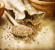 Buckwheat groats in a wooden spoon