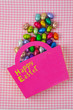 Chocolate Easter eggs falling from a pink bag