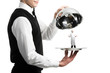 hands of waiter with cloche and chef