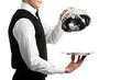 hands of waiter with cloche lid cover