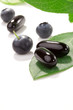 Photo: Bilberry pills and berries Bilberry pills and berries
