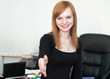 The beautiful woman at office welcomes the visitor