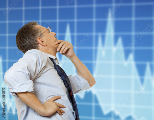 Photo: The Exchange broker looks at the monitor The Exchange broker looks at the monitor