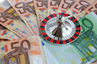 Photo: roulette wheel on euro banknotes roulette wheel on euro banknotes