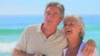 Mature couple using binoculars