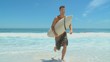 Man with surf board coming out of the water 