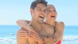 Video: Happy couple hugging on a beach Happy couple hugging on a beach