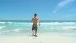 Man posing with surfboard in front of the sea
