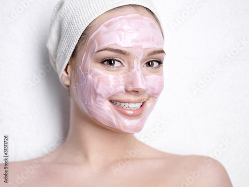 Photo: Smiling woman with facial mask Smiling woman with facial mask