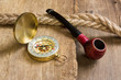 Compass and a pipe with a rope