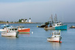 Fishing boats in Inner Harbor with lighthouse