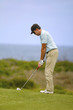 Foto: Golfer at address on the fairway Golfer at address on the fairway