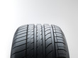 Close up of a summer high performance tyre on white fond