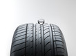 Summer high performance tyre with an old toy car on top