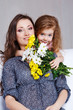 Girl embracing mom
