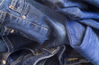 folded new blue jeans as fashion background folded new blue jeans as fashion background
